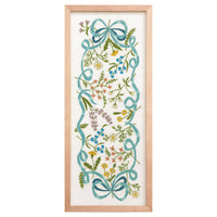 Decorative wall art with floral and ribbon design in a wooden frame on a white background