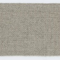 Textured beige fabric ribbon tape on a white background