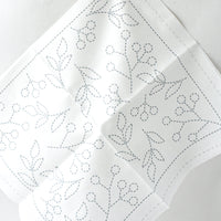 White fabric with dashed outlines for sashiko embroidery