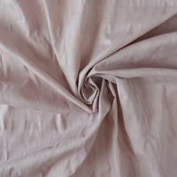 Close-up of pink fabric with folds