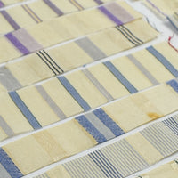 Collection of fabric swatches with various patterns and colors on a white background
