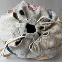 Fabric drawstring bag on a white background