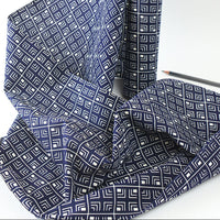 Blue fabric with geometric pattern on a white background