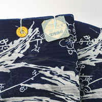 Two folded fabric pieces with a floral pattern on a white background