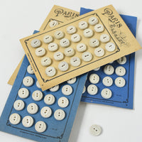 White Buttons "Paris Elegant" on Ivory card, 1/2"