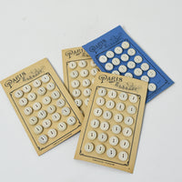 White Buttons "Paris Elegant" on Ivory card, 1/2"