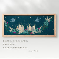 Framed embroidered artwork with candles and birds on a dark blue background