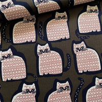 Pattern of pink cats with black outlines on a brown background