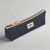 Blue pencil case with a zipper and 'Luddite' branding on a white background