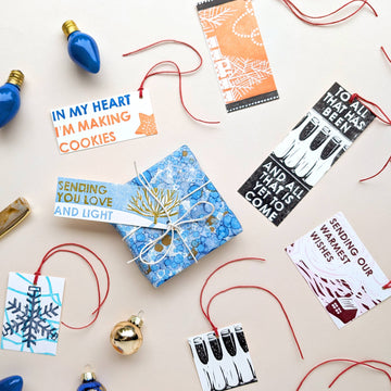 Collection of Christmas-themed cards and decorations on a beige background