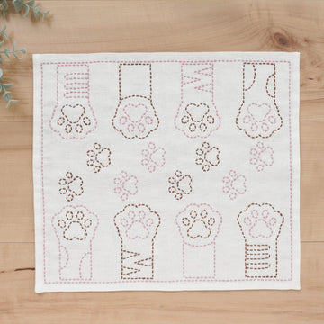 Embroidered fabric with paw prints