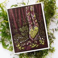Card with nature-themed design on a bed of green moss