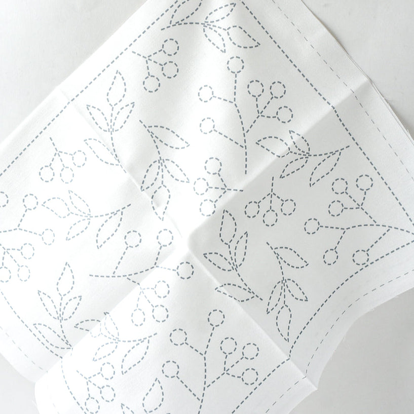 White fabric with dashed outlines for sashiko embroidery
