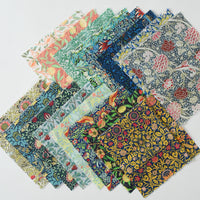 Set of fabric swatches with floral patterns on a light gray background
