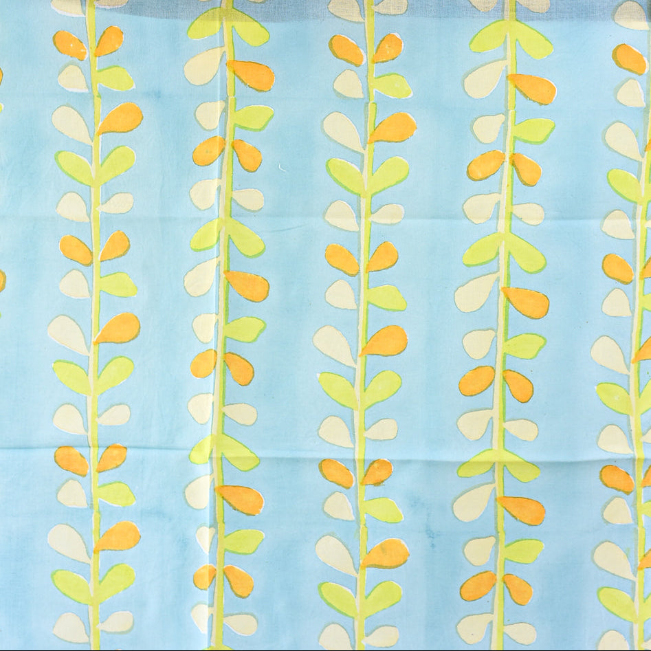 Fabric with a leaf pattern on a blue background