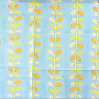 Fabric with a leaf pattern on a blue background