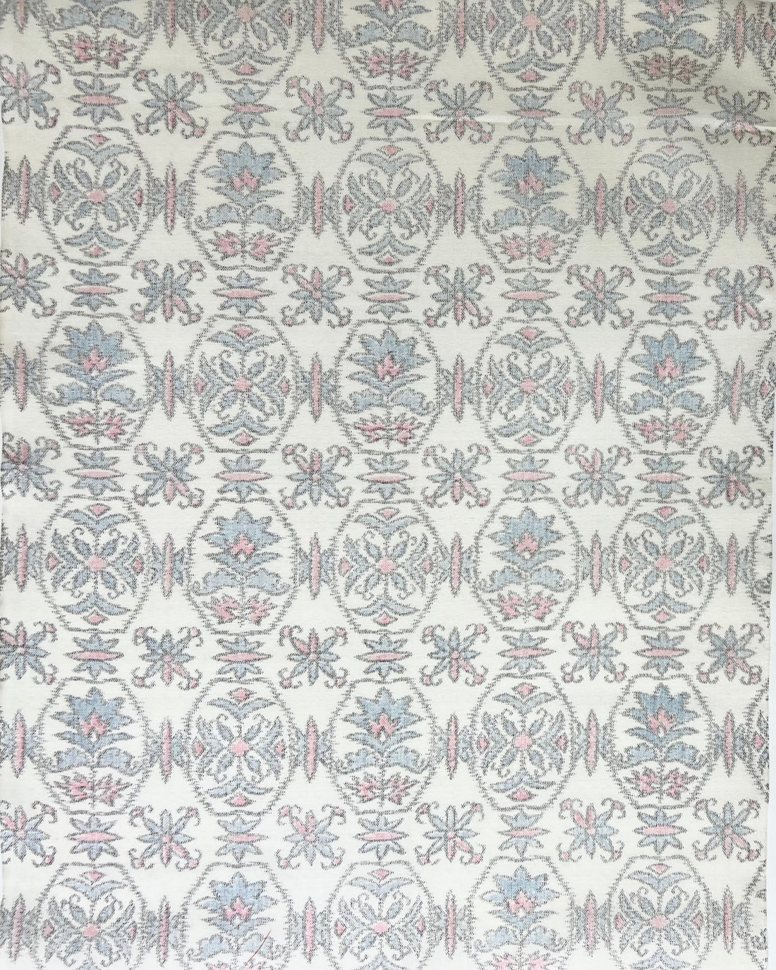 Patterned fabric swatch with geometric design on a white background