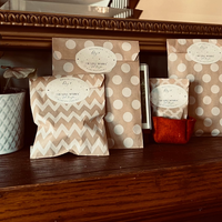 Decorative packages on a wooden surface with a mirror in the background
