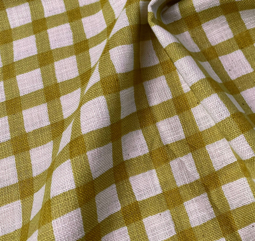 Close-up of green and pale pink checkered fabric