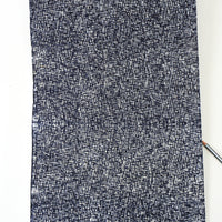 Textured black and white fabric on a white background
