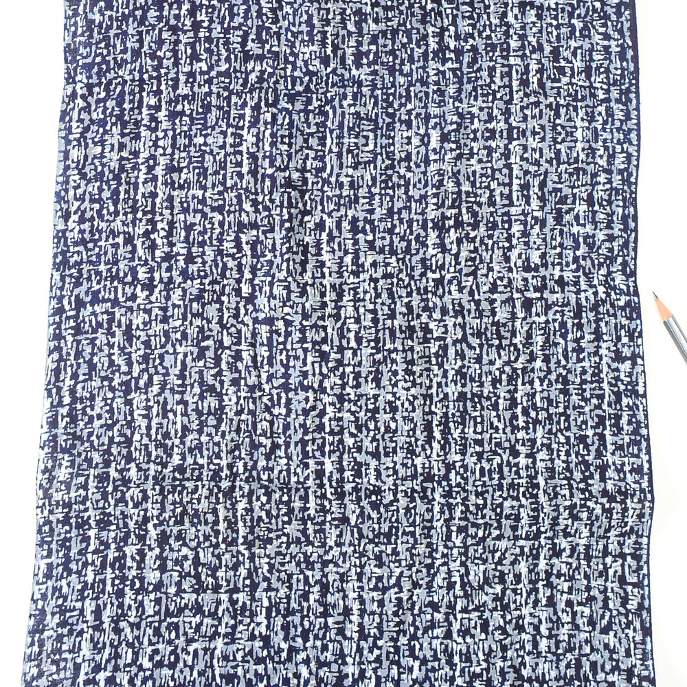Textured blue and white fabric with a pencil on the right side
