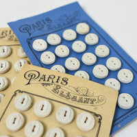 White Buttons "Paris Elegant" on Ivory card, 1/2"