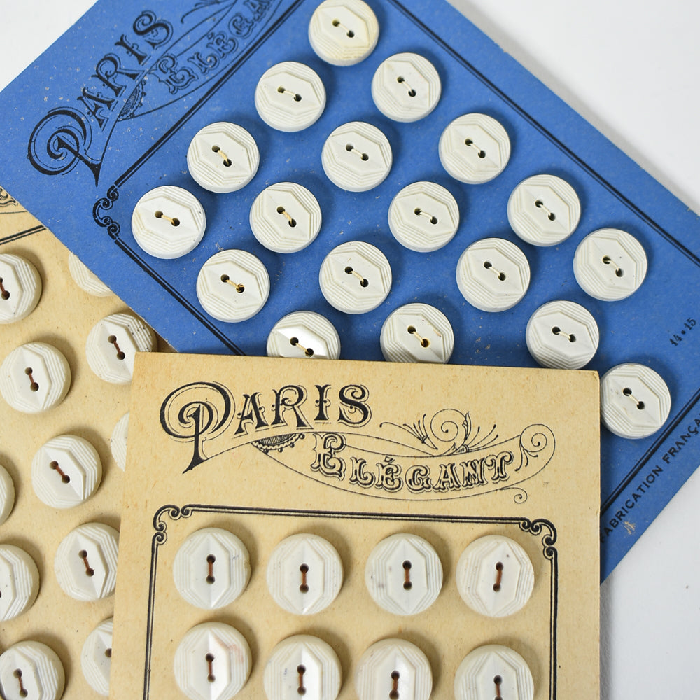 White Buttons "Paris Elegant" on Ivory card, 1/2"