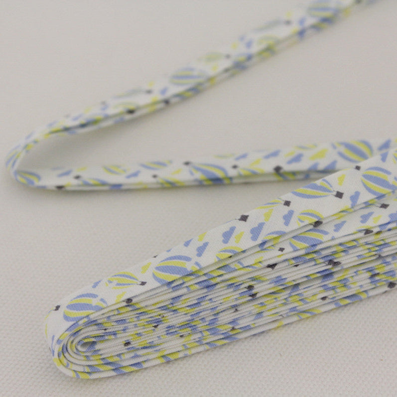 Decorative bias binding tape with blue and yellow pattern of hot air balloons.