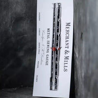 White card with black text and design on a textured dark background