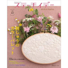 Magazine cover with embroidery hoop and floral design on a pink background