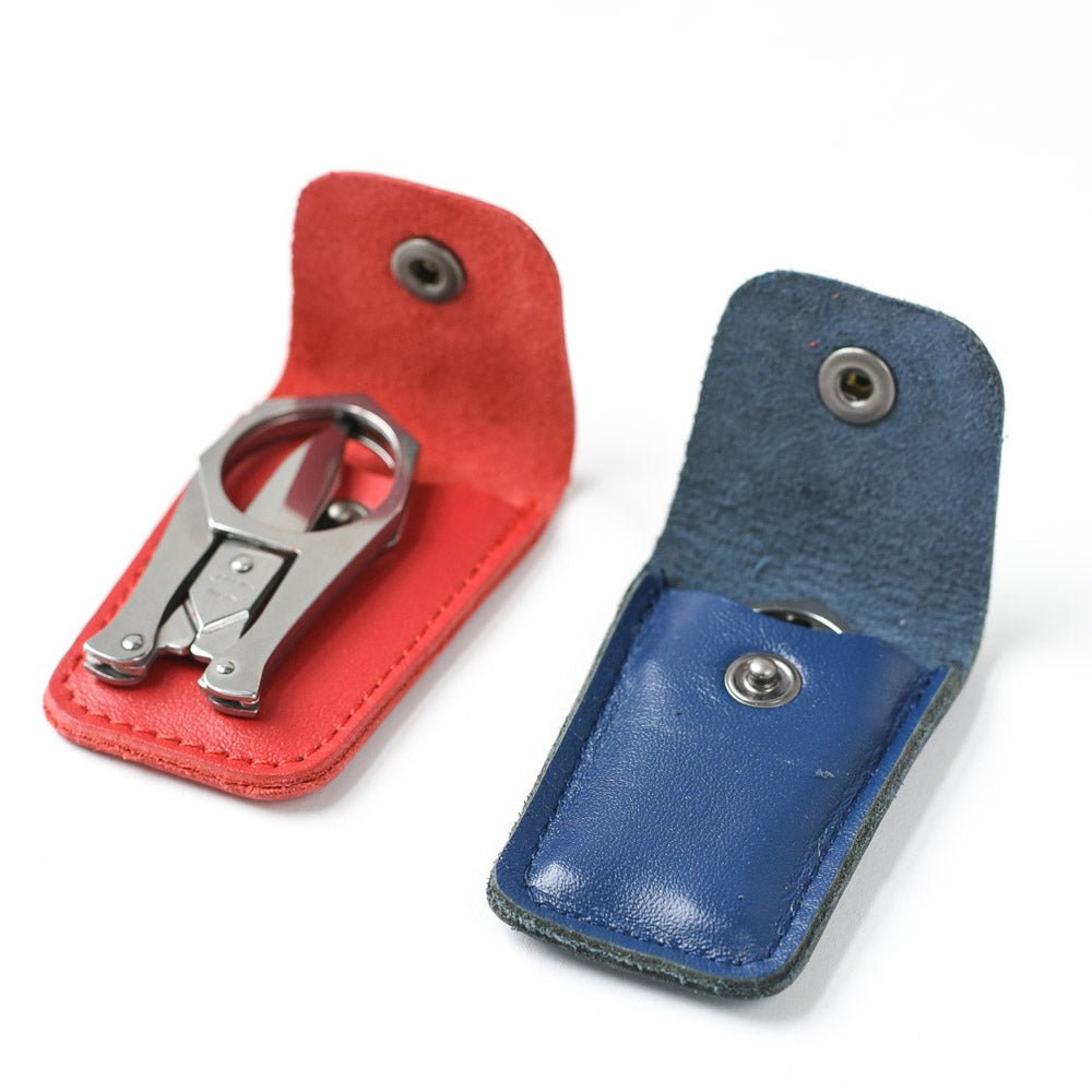 Sajou Folding Scissors, shown with leather cases in blue and red | Brooklyn Haberdashery
