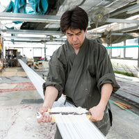 Artisan making washi paper cords for Iida Mizuhiki Sewing Pins | Brooklyn Haberdashery