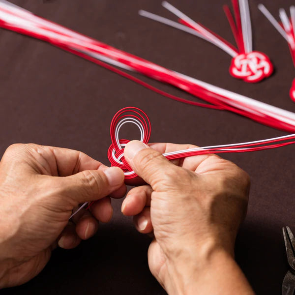 Artisan hands making knots for Iida Mizuhiki | Brooklyn Haberdashery