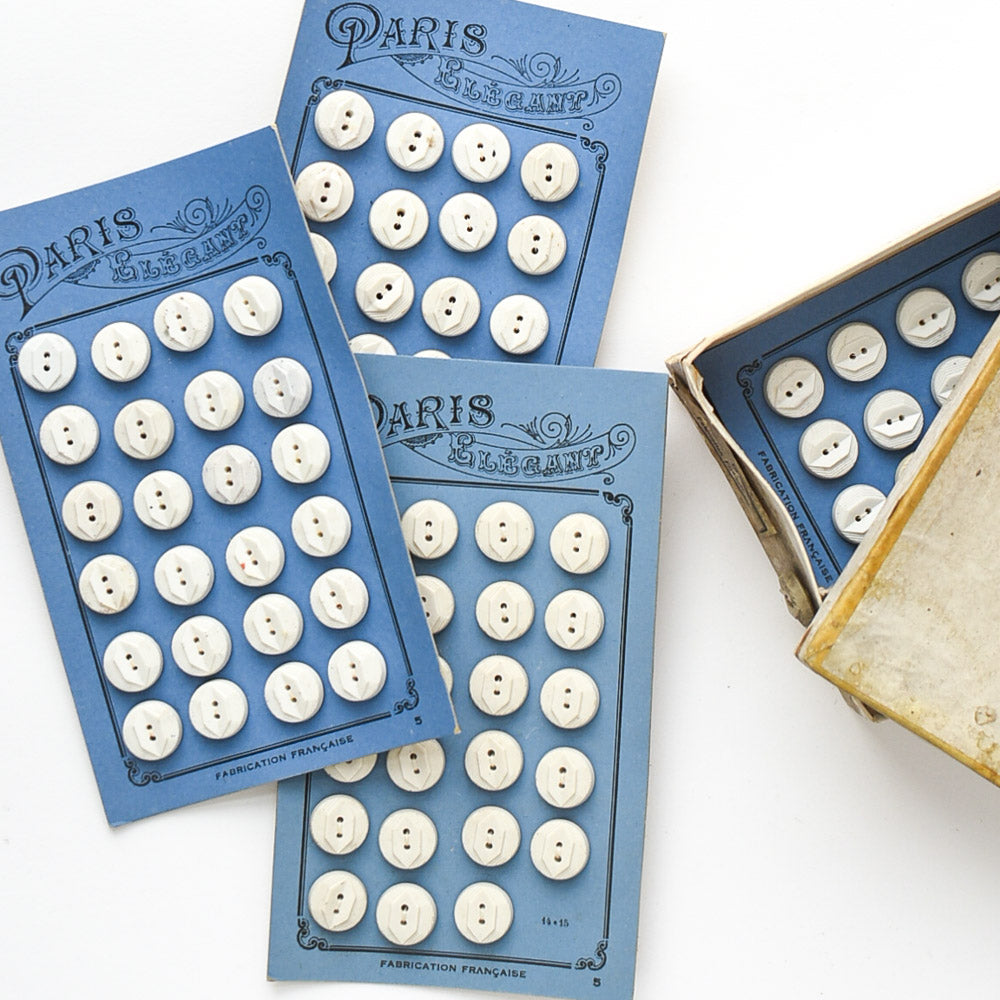 White Buttons "Paris Elegant" on Blue card, 1/2"