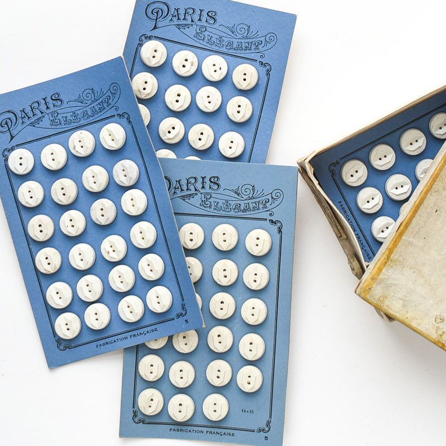 White Buttons "Paris Elegant" on Blue card, 1/2"