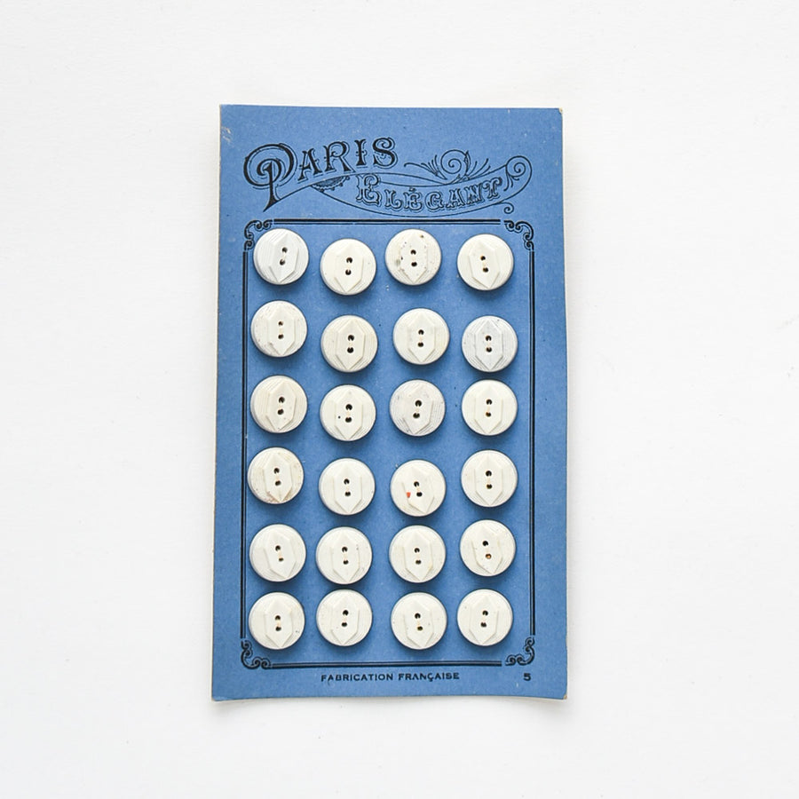 White Buttons "Paris Elegant" on Blue card, 1/2"